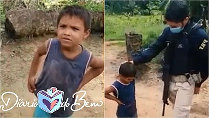 Criança ganha de policiais rodoviário um tablet.